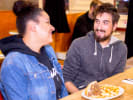 Food Tour + Drink Upgrade - The Best of Philadelphia's Culinary Scene in Philadelphia: drink philly tour   friends trying a philly cheesesteak