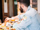 Food Tour - Pittsburghâ€™s Culinary Classics in Pittsburgh: man eating in a restaurant