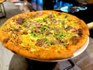 Food Tour + Drink Upgrade - Raise a Glass to San Antonio’s Flavors in San Antonio: pizza out of the oven