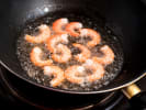 Cooking Class - Surf & Turf Delights - Date Night in Downtown Dallas: frying Shrimp