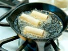 Team Building Cooking Class - Asian Takeout Favorites in Austin: frying egg rolls