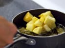Cooking Class - Authentic Spanish Favorites: frying patatas bravas