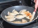 Cooking Class - Perfect Handcrafted Potstickers in Minneapolis: frying potstickers