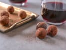 Virtual Wine Tasting - Comfort and Joy Holiday Wine: glasses of red wine with chocolate truffles on a tray