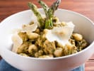 Cooking Class - Gnocchi From Scratch in Louisville: gnocchi in a white bowl with sage and asparagus