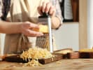 Cooking Class - Pizza-making - Family Fun in Manhattan: grating cheese