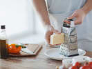 Cooking Class - Spanish and South American Fusion Fare: grating cheese