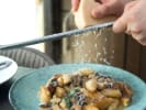 Cooking Class - Rustic Italian Favorites: Gnocchi & Gelato: grating cheese over gnocchi