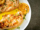 Cooking Class - Tuscan Terrace - Date Night in Manhattan: Grilled chicken with lemon and herbs â€“ Juicy grilled chicken breasts served in a lemon and herb sauce, garnished with fresh herbs and charred lemon slices.