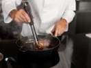 Cooking Class - Flavorful French Spring Feast in Northern Virginia: grilling steak in a plan up close using tongs for searing the sides evenly