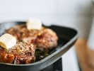 Cooking Class - Fresh Springtime Cooking in Downtown Dallas: grilling two steaks with butter on top