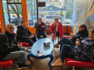 Food Tour - Vibrant Kerns and East Burnside in Portland, OR: group of people eating on a Protland food tour stop