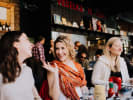Food Tour - East Village Cuisine - NYC: guests laughing at a restaurant during food tour