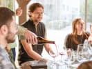 Food Tour - Portland Wine Tasting in Portland, OR: guide serving wine to their guests
