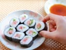 Cooking Class - Kid Chef Sushi Celebration in Houston: hand grabbing roll of maki sushi