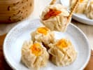 Cooking Class - Dumplings From Around the World in Manhattan: holding shrimp shumai with chopsticks