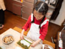 Cooking Class - Kid Chef Sushi Celebration in Houston: kid making sushi rolls