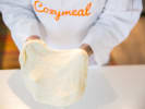 Cooking Class - Sweet and Savory Pizza Perfection in Manhattan: chef in Cozymeal apron kneading fresh pizza dough