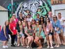 Food Tour - Sightseeing in Downtown/Old Town Las Vegas for Foodies in Las Vegas: large group of people next to a tiger graffiti