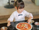 Cooking Class - Kids' Pizza Party: little girl making homemade pizza