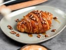 Cooking Class - Hands-On French Croissant Workshop in Naperville: maple syrup glazed croissant with pecans on top