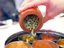 Cooking Class - A Taste of Vegan Indian Comforts in East Bay: mixing Indian spices