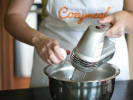 Cooking Class - Make Flavorful New Orleans Sweets in South Bay & Peninsula: mixing cooking batter with an electric whisk and cracking egg in a bowl
