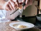 Cooking Class - Pasta for Beginners Workshop: Grating Cheese Over Ravioli