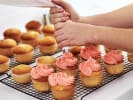 Online Cooking Class - Cupcake Decorating for Beginners: person icing cupcakes