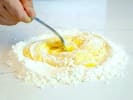 Online Cooking Class - Authentic Italian Pasta From Scratch: chef mixing flour and eggs to make pasta dough