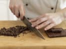 Online Cake Decorating Class - Mastering Italian Cuisine With a Michelin-Trained Chef: close up hand cutting chocolate