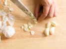 Online Cooking Class - Pantry Paella: chef slicing garlic
