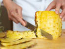 Online Cooking Class - Vegan Jackfruit Tacos: chef slicing a pineapple