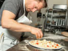 Cooking Class - Crafting Authentic Pizza in Brooklyn: topping pizza