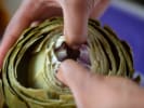 Cooking Class - Flavors of Tuscany in Carlsbad & Oceanside: peeling artichoke layers