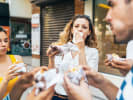 Weekend Food Tour - Gastronomic Gems of South Nashville in Nashville: people enjoying a burger on a food tour
