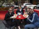 Food Tour - Landmarks of Manhattan in Manhattan: people enjoying pizza on a food tour