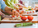 Team Building Cooking Class - Vegetarian Culinary Contest: people slicing vegetables