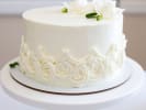 Cooking Class - Master Elegant Cake Decorating in Northern Suburbs: perfectly decorated elegant vanilla sponge cake with buttercream icing decorations and edible flowers