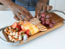 Online Cooking Class - Show-Stopping Charcuterie: person arranging a charcuterie board