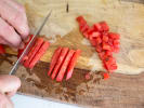 Online Cooking Class - The Office-Themed Menu: Kevin's Famous Chili: person dicing tomatoes for pico de gallo