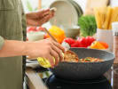 Cooking Class - Asian Takeout From Scratch: person frying rice in a pan