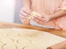 Online Couples Cooking Class - How to Make Pierogi: person making pierogies
