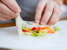 Team Building Cooking Class - Mastery of Fresh Thai Spring Rolls: person making spring rolls