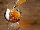 Virtual Wine Tasting - Brandy and Cognac Pairings With Chocolate: person pouring cognac