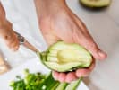 Online Cooking Class - Sushi Rolls Two Ways: person scooping avocado