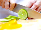 Online Couples Cooking Class - The Art of Infused Liquors: person slicing a lime