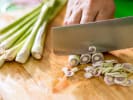 Cooking Class - Mastering Asian Chinese: person slicing lemongrass