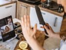 Online Mixology Class - Sensational Sips for Swifties: person slicing lemons in an online mixology class