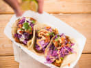In-Office Team Building - Guac-Off Competition: person squeezing lime juice on homemade tacos